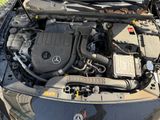 a picture of a car engine with its hood open
