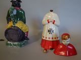 three figurines that are sitting next to each other