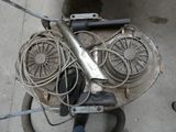 an overhead view of a motorbike with wires and a fan on it