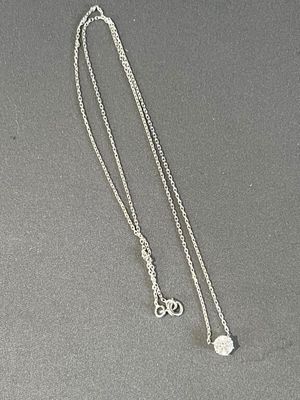 silver plated necklace with a heart and two charms on a chain
