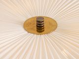 a close up of a white umbrella with a gold rim