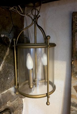 a light that is hanging from a wall in a room