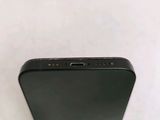 an apple iphone sitting on top of a table next to a white wall