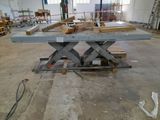 a picture of a workbench in a warehouse with a lot of wood