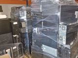 a large stack of computer equipment in a warehouse