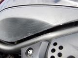 a close up view of a motorcycle with the front seat up