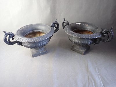 two vases that are sitting next to each other on a table