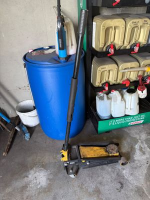 an image of a garage with a mop, bucket, and other items