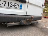a close up of a truck with a tow bar attached to it ' s bumper