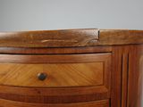 a close up of a wooden cabinet with drawers