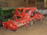 an image of a tractor and a plow in a barn
