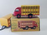 two toy trucks sitting on top of a box