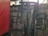 a lot of old metal items in a warehouse