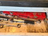 a drawer full of tools on a table in the kitchen
