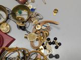 a pile of assorted jewelry on a table