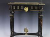 an image of a small table with a clock on it