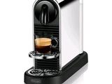 a close up of a coffee machine with a cup of coffee