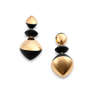 a pair of black and gold earrings on a white background