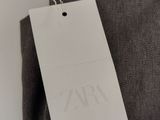 a close up of a tag on the back of a pair of pants