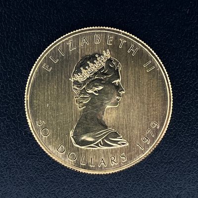 gros plan d'une pièce de monnaie sur laquelle figure une tête de femme
