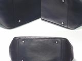 two photos of a black leather purse with a silver buckle