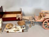 a toy horse drawn carriage with a wooden box on the back