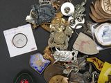 many different types of badges on a black surface
