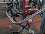 a gym with a lot of machines in the room