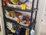 a black shelf with a lot of food on it