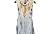 blue and white dress on a hanger on a white background