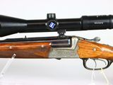 the rifle is sitting on the table with a scope on it ' s side
