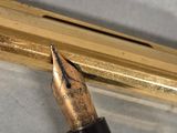 a pen that is sitting on top of a piece of paper