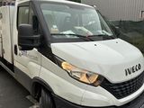 a white van that is parked in a parking lot