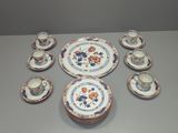 many plates and cups that are sitting on a table