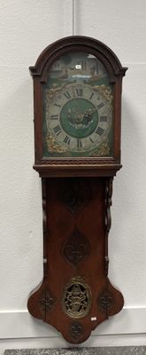 a grandfather clock that is on the wall by the wall
