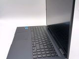 a laptop that is sitting on a white surface