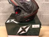 the helmet is sitting on top of the box on the table