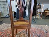 a chair that is sitting on a rug in a room