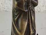 an image of a statue of a woman holding a cat