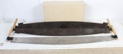 an old pair of saws sitting on top of a table