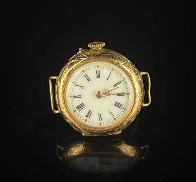 an antique gold pocket watch with roman numerals and roman numerals on the face