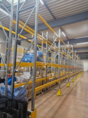 a large warehouse filled with lots of shelves and pallets