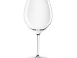 a wine glass that is sitting on a table