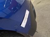 a sticker on the hood of a blue car