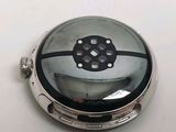 a silver pocket watch with a black face on a white surface
