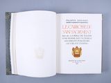 an open book with a picture of a clock on it