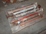 a pile of pipes on a pallet in a warehouse