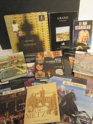 a lot of books that are sitting on a table