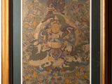 an image of a painting of a buddha in a frame on a wall