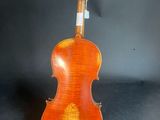 an old violin with a wooden back and a long neck